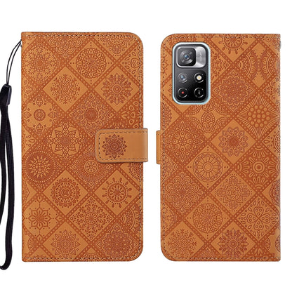 Ethnic embossed leather phone case with patterned cover, foldover flap, and camera cutout