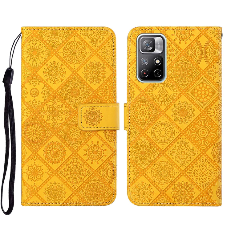 Yellow embossed leather wallet phone case with floral pattern and side strap