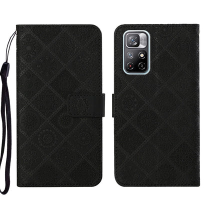 Black embossed leather phone case with folio flap and textured pattern, wrist strap