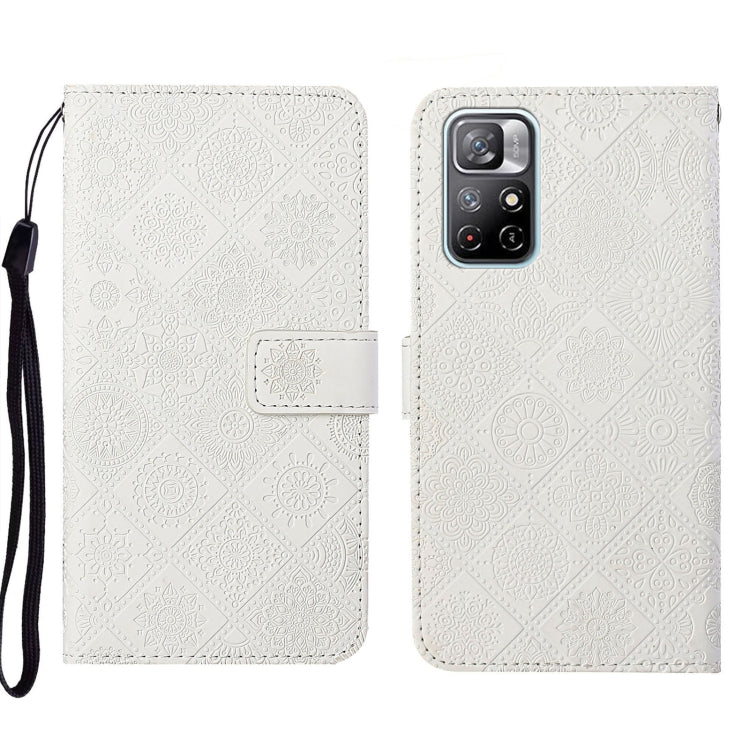 White embossed leather phone case wallet with flip cover and wrist strap, camera module shown.