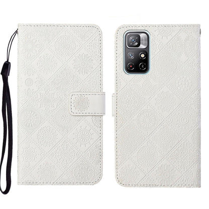 White embossed leather phone case wallet with flip cover and wrist strap, camera module shown.
