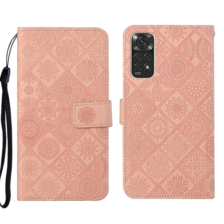 Pink embossed leather wallet phone case with floral pattern and side strap