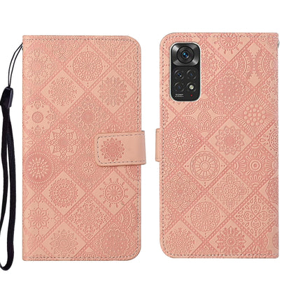 Pink embossed leather wallet phone case with floral pattern and side strap
