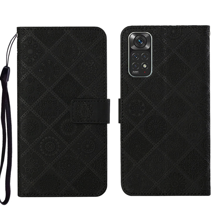 Black embossed leather phone case wallet with flip cover and wrist strap.
