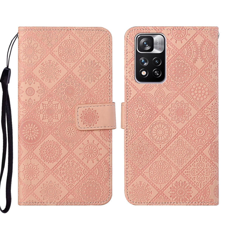 Pink embossed leather wallet phone case with floral pattern, front flap and strap
