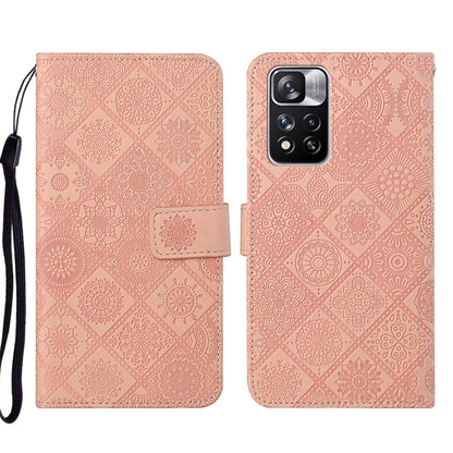 Pink embossed leather wallet phone case with floral pattern, front flap and strap