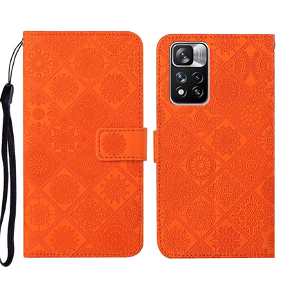 Orange embossed leather phone case with folio flap and raised camera cutout, wrist strap