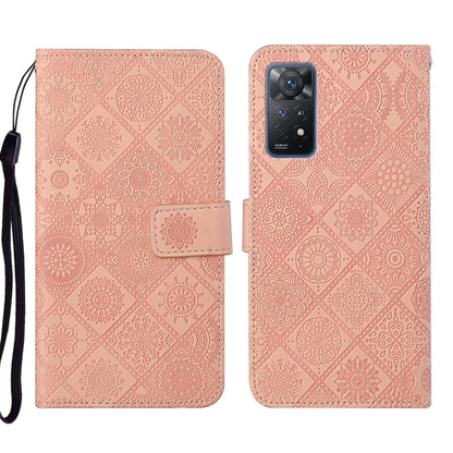 Pink embossed leather phone case with floral pattern and built-in stand strap