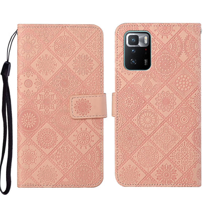 Pink embossed leather wallet phone case with floral pattern and magnetic flap