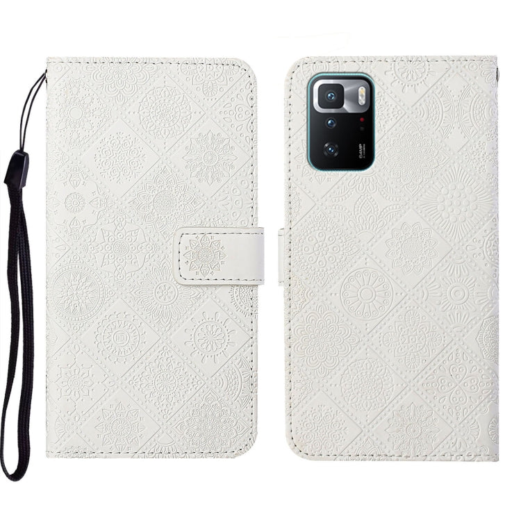 White embossed leather folio phone case with wrist strap, flap closure, camera opening