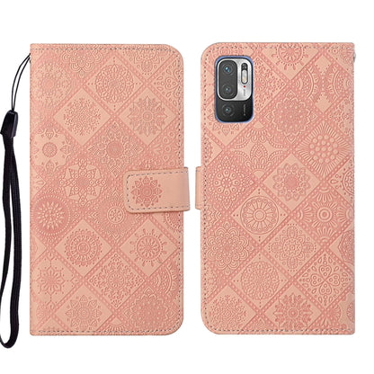 Pink embossed leather wallet phone case with floral pattern and side wrist strap