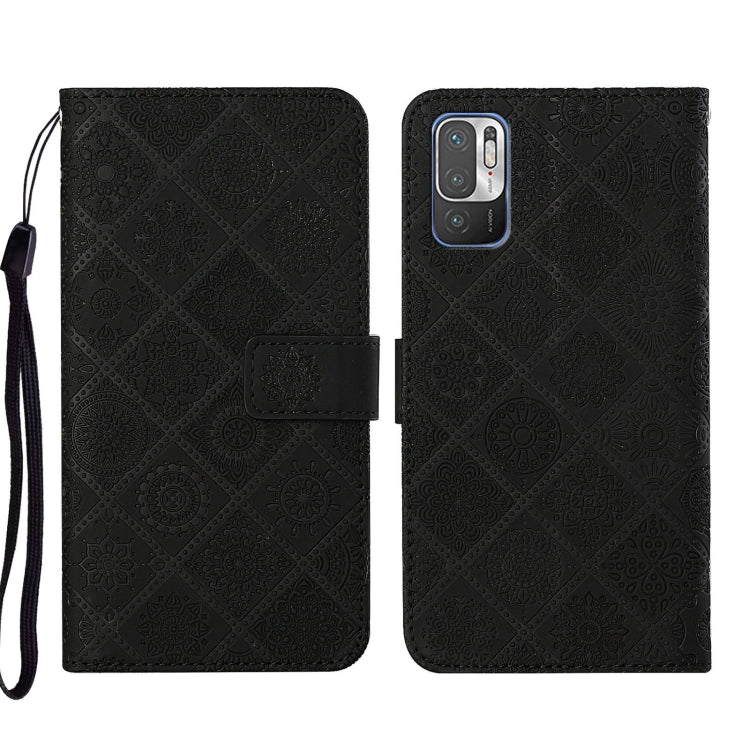 Black embossed leather phone case wallet with flip cover and wrist strap.