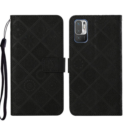 Black embossed leather phone case wallet with flip cover and wrist strap.