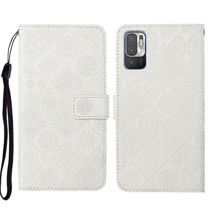 White embossed pattern leather folio phone case with wrist strap and rear camera cutout