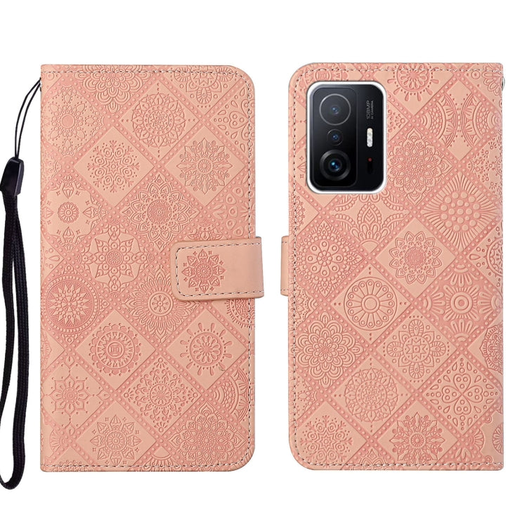 Pink embossed leather wallet phone case with floral pattern, front camera cutout