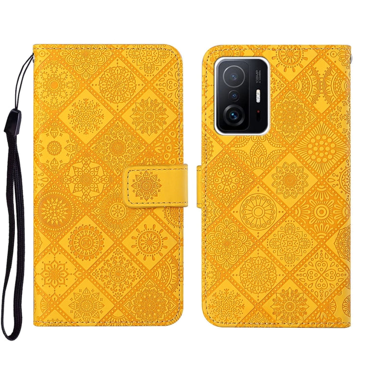 Folio leather phone case with embossed geometric pattern, yellow-gold, wrist strap
