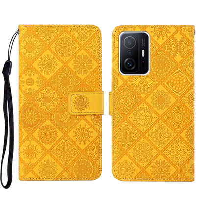 Folio leather phone case with embossed geometric pattern, yellow-gold, wrist strap