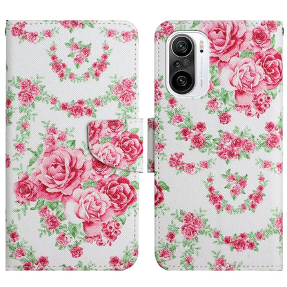 Flip leather phone case with pink rose and green floral pattern, snap closure.