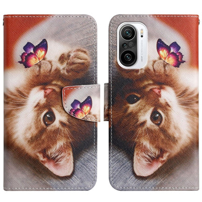 Flip leather phone case with cat face and butterfly print, snap closure and card slot.