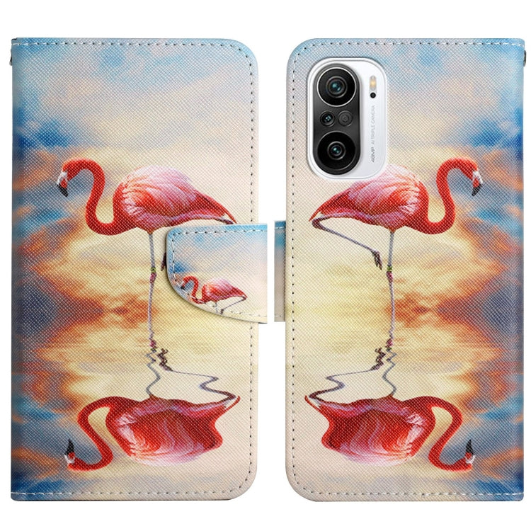 Flip leather phone case with flamingo pattern and card holder on blue background