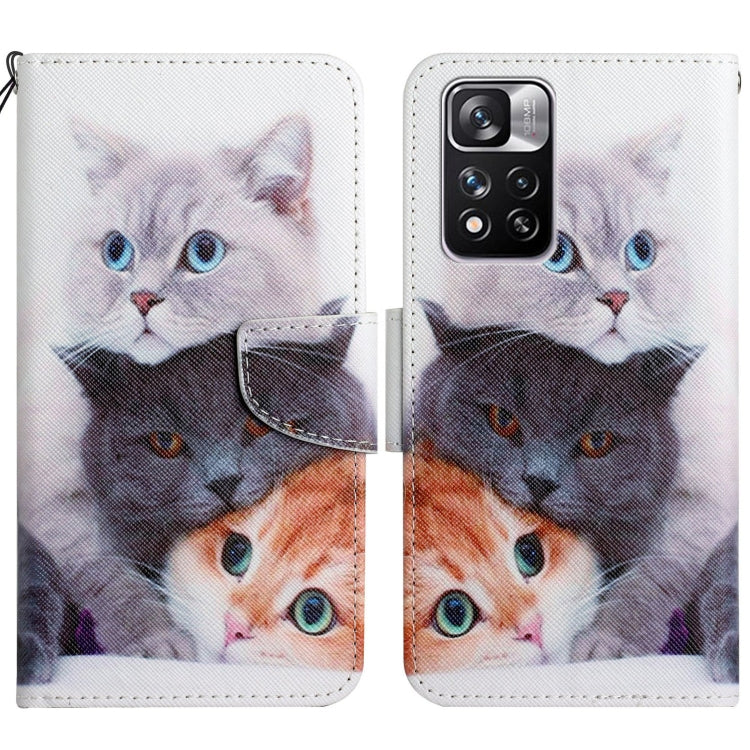 Flip leather phone case with cat faces in white, black, and orange tones