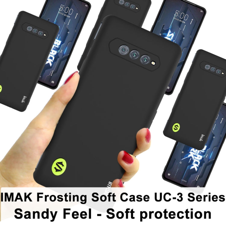 Black frosted TPU phone case held in hand, front and back with cutouts
