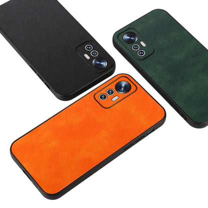 Litchi-texture PU phone cases in black, orange, and green with camera cutouts