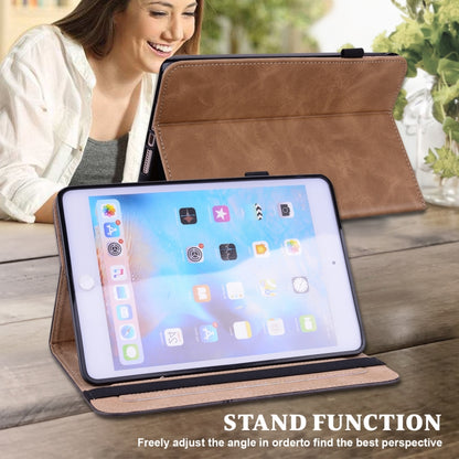 Brown embossed leather tablet case propped up as a stand with screen cover
