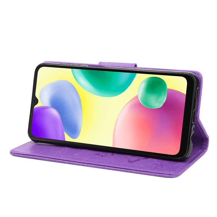Purple folio phone case in butterfly embossed leather, shown in landscape stand position.