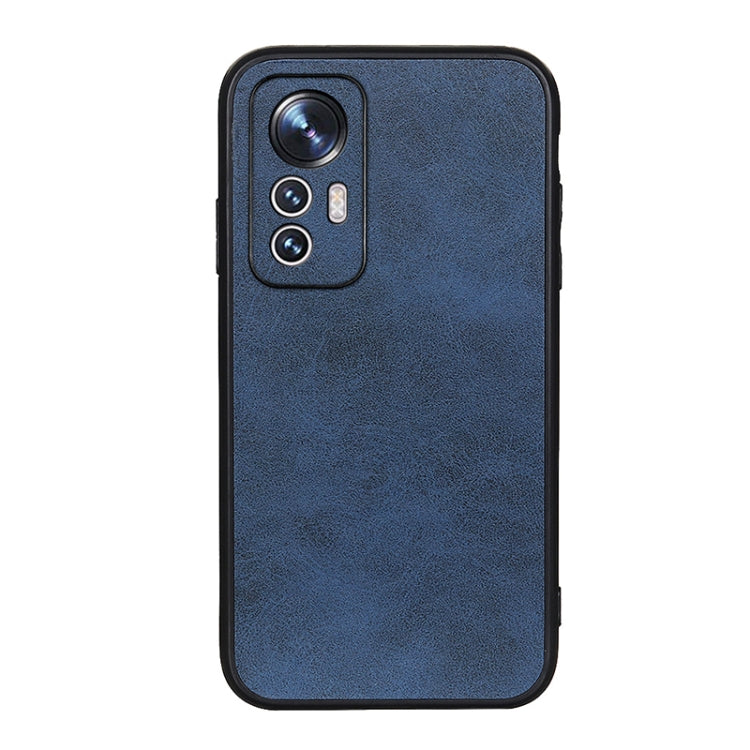Blue calf-texture PU phone case with camera lens cutout and side port openings