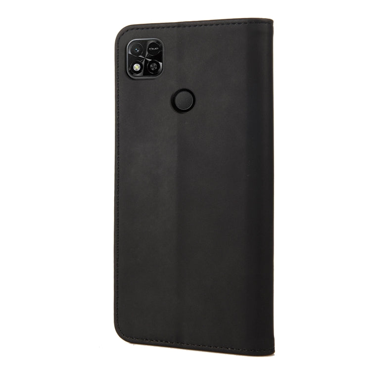 Black leather folio phone case with camera cutout and round magnetic closure