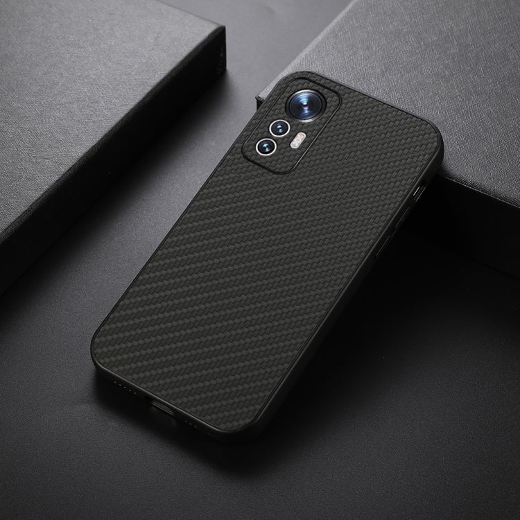 Shockproof phone case with carbon fiber texture, black finish, angled view with camera cutouts.