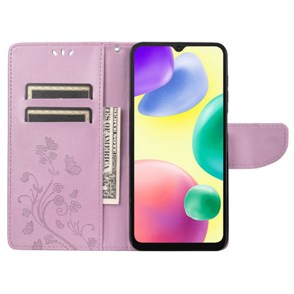 Light purple flip phone case with butterfly flower pattern, card slots, and stand cover open