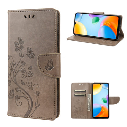 Flip leather phone case with butterfly-and-flower embossed pattern, gray, card slots