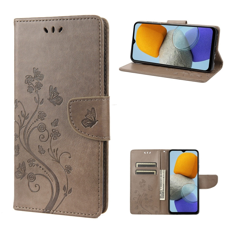 Flip leather phone case with butterfly-and-flower embossed pattern, gray, stand view