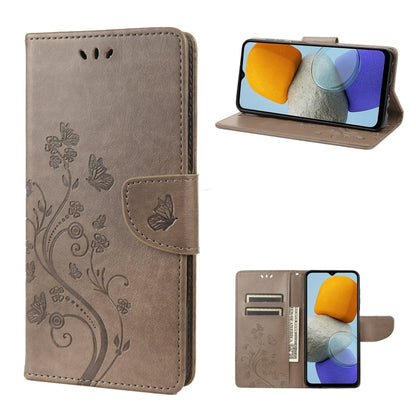 Flip leather phone case with butterfly-and-flower embossed pattern, gray, stand view
