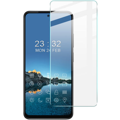 Clear tempered glass screen protector film applied to smartphone front