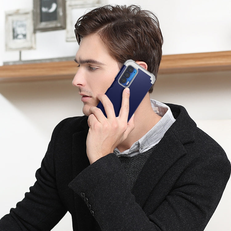 Navy blue and gray phone case worn on a man holding a smartphone