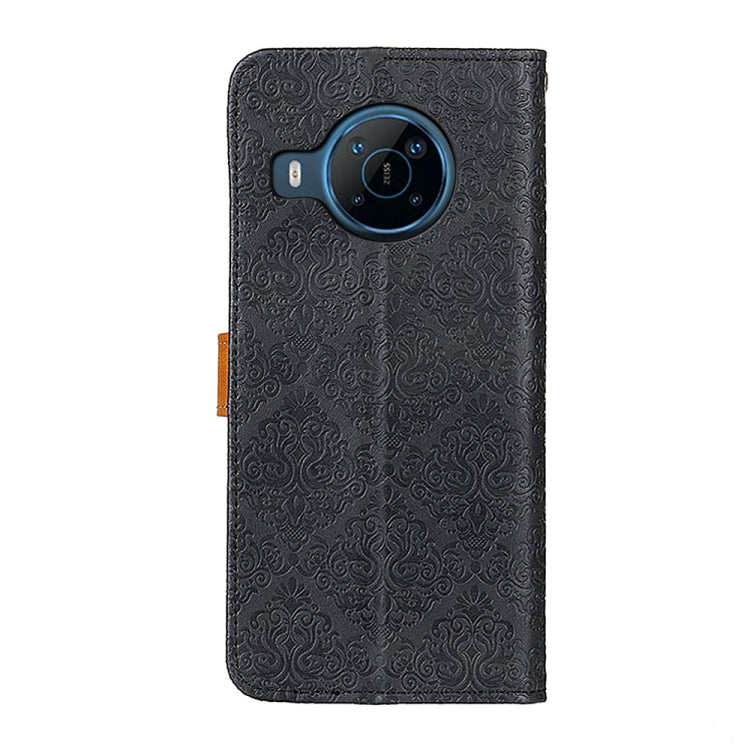 Embossed black leather phone wallet case back with camera cutout and round speaker ring