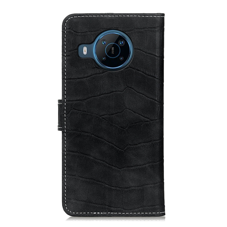Black crocodile-texture phone case with camera cutout and stitched edge seams.