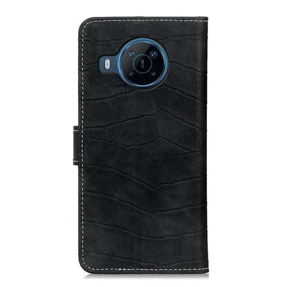 Black crocodile-texture phone case with camera cutout and stitched edge seams.