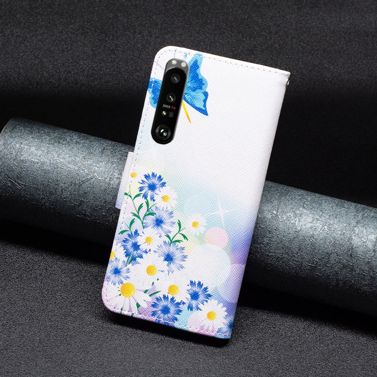 Leather phone case back with blue floral cluster and butterfly; dual camera cutouts visible