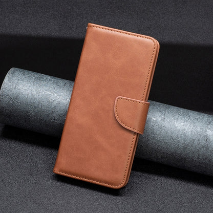 Brown leather phone wallet case with stitched edges and front latch panel