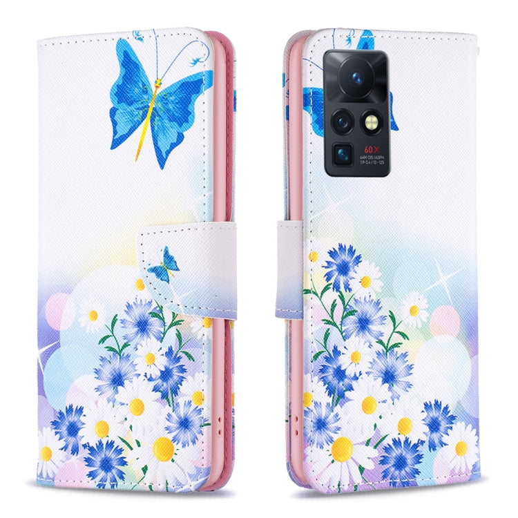 Leather-style phone wallet case with butterfly and blue daisy floral illustration, magnetic flap.