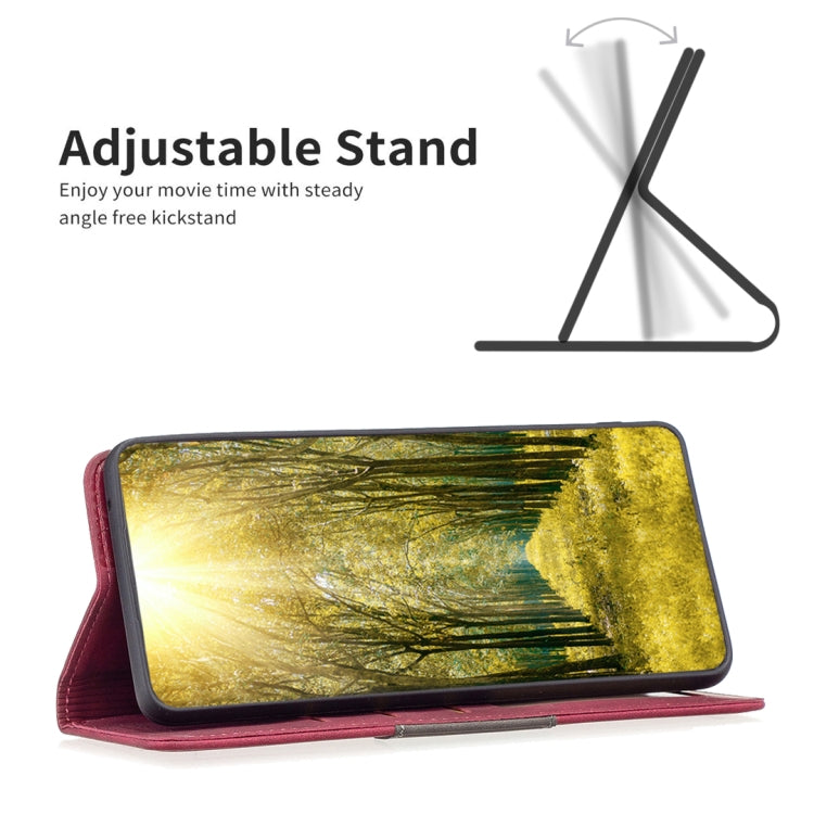 Red leather phone folio case propped on an adjustable stand