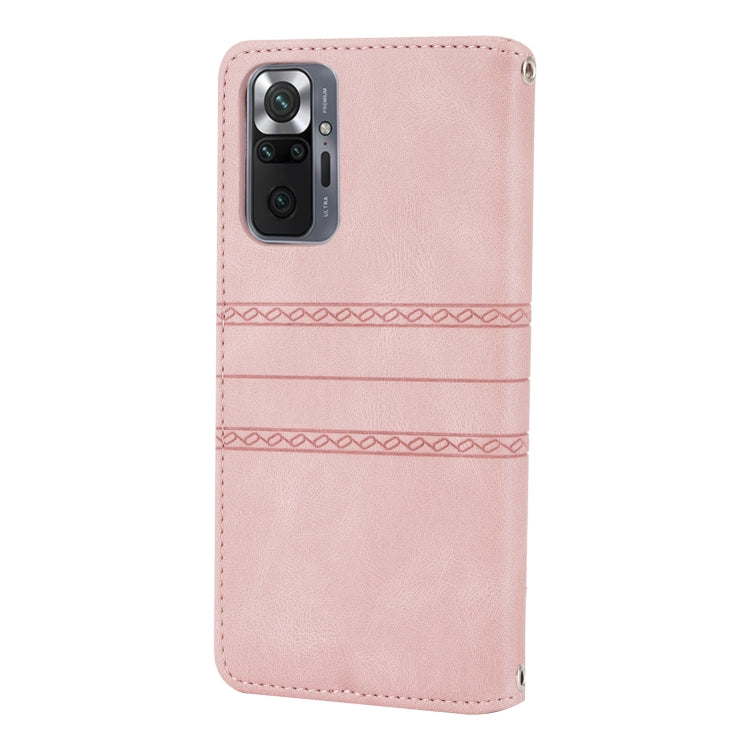 Pink leather-look flip phone case with embossed stripe design and stitched edges