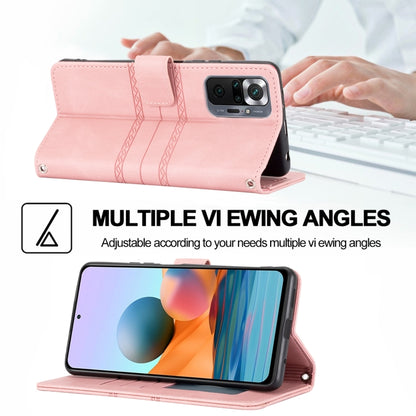 Pink magnetic flip phone case with stand and embossed striped front flap