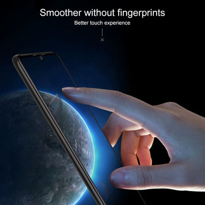 Tempered glass screen protector being applied by hand, smooth touch surface