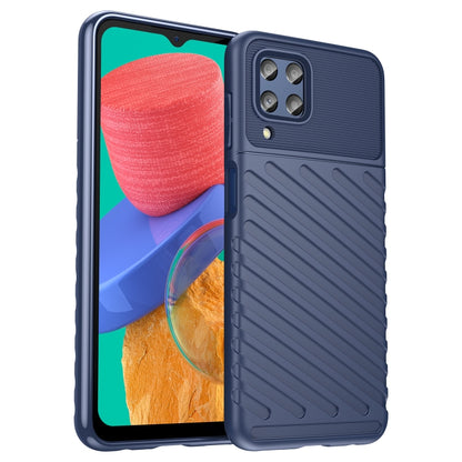 Blue shockproof TPU phone case with ribbed back and camera cutout, front phone visible