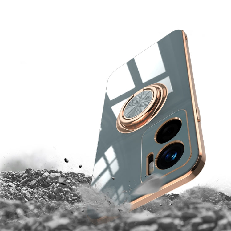 White phone case with gold magnetic ring holder; camera cutouts visible